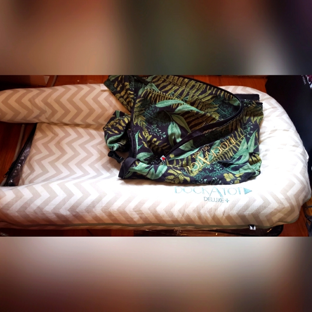 DockATot Deluxe Plus Chevron Print and night leaf print